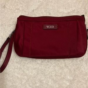 Tumi wristlet..great for phone .cards .money. all in one little wristlet..